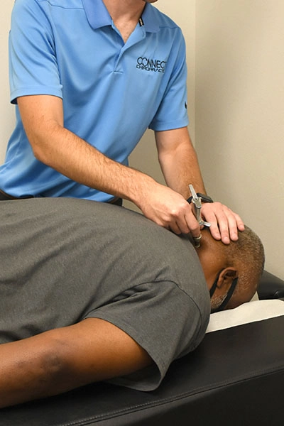 Chiropractor Delafield WI Alexander Young Adjusting Neck